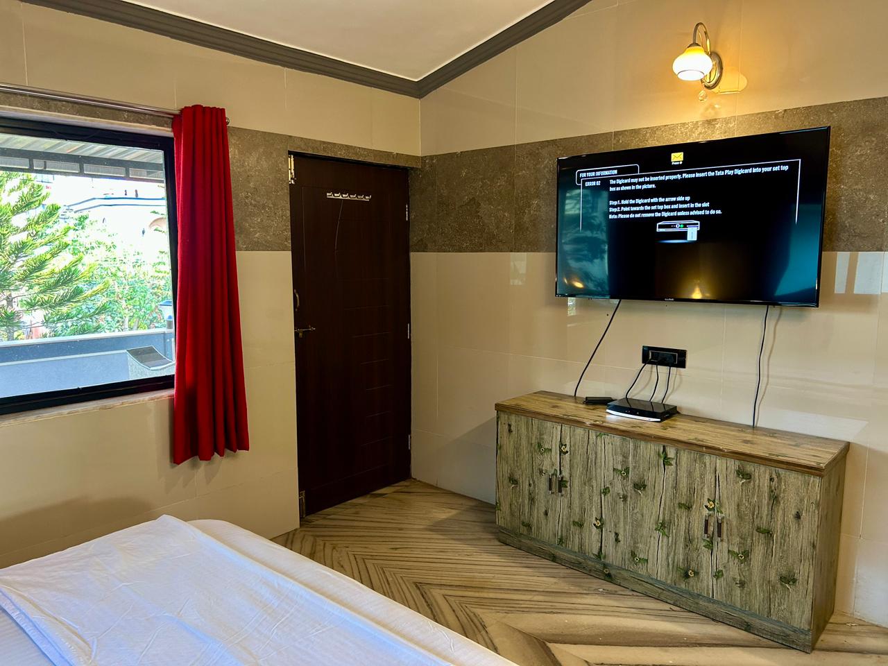 Bedroom with television at Shivaaz Hill Top Villa, Mapusa