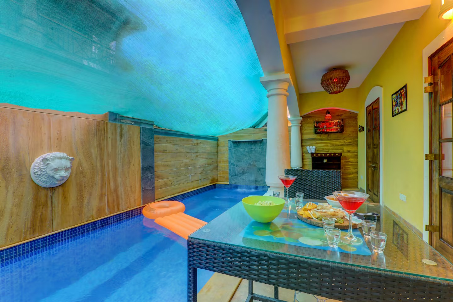 Poolside seating at House of Legends Villa, Saligao