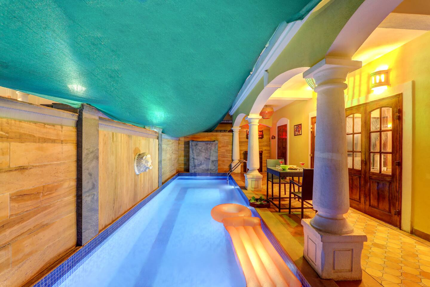 Illuminated pool at House of Legends Villa, Saligao