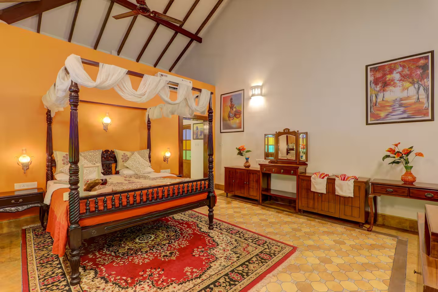 Four-poster bedroom at House of Legends Villa in Saligao